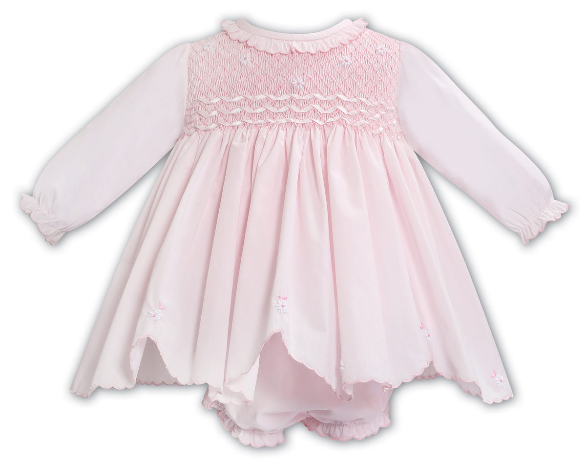 baby smocked dress in Cotton Gauze for Babies White satin ribbon flowers accent the smocking and embroidery pattern Baby Dolman Sleeve Smocked Dress