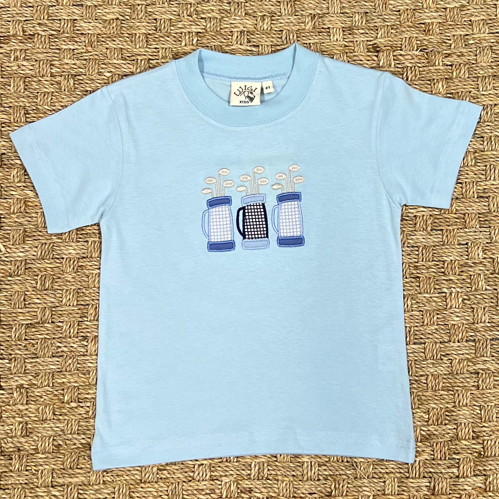 Luigi Tee, Three Golf Bags on Light Sky Blue