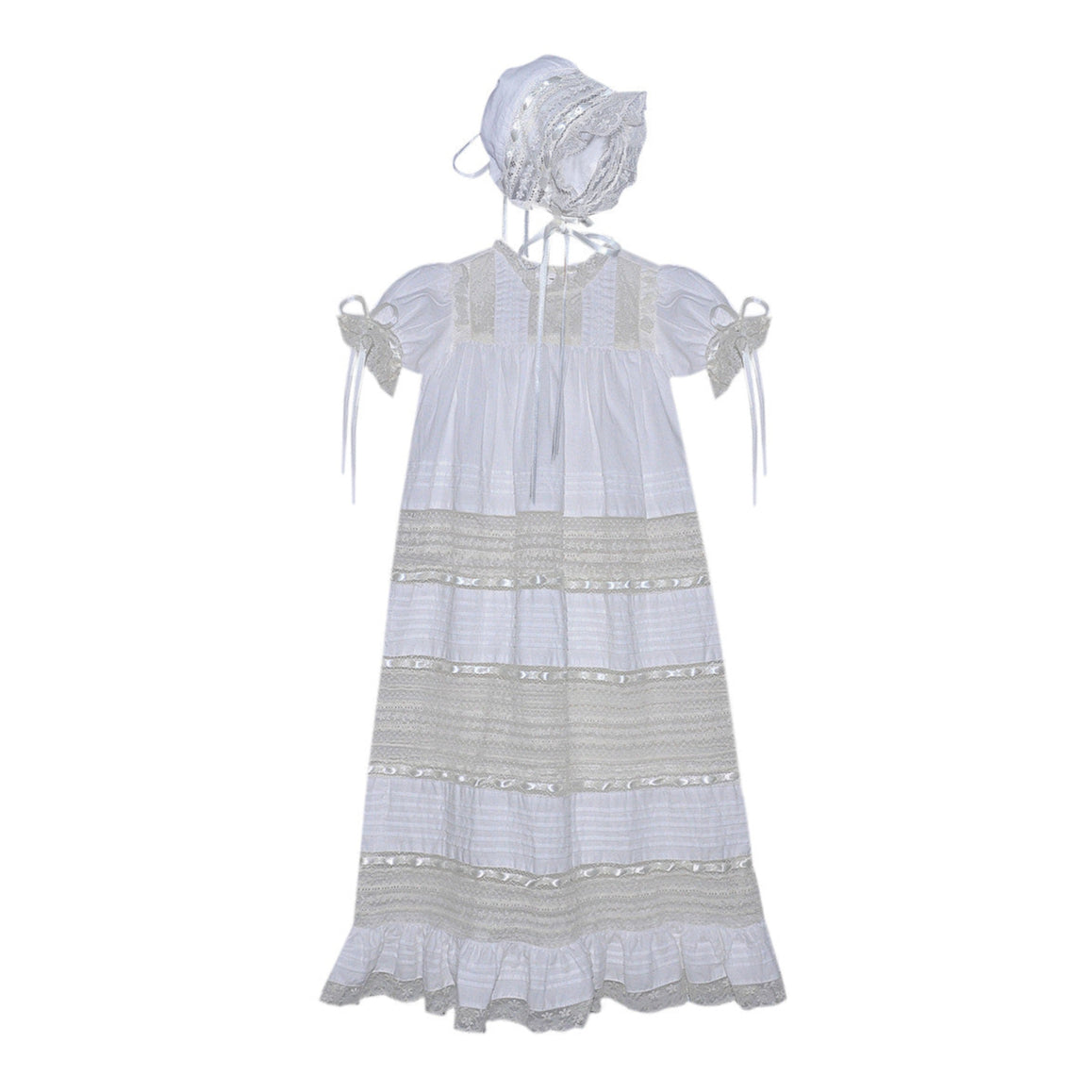 White dress with ecru lace and matching bonnet on a white background