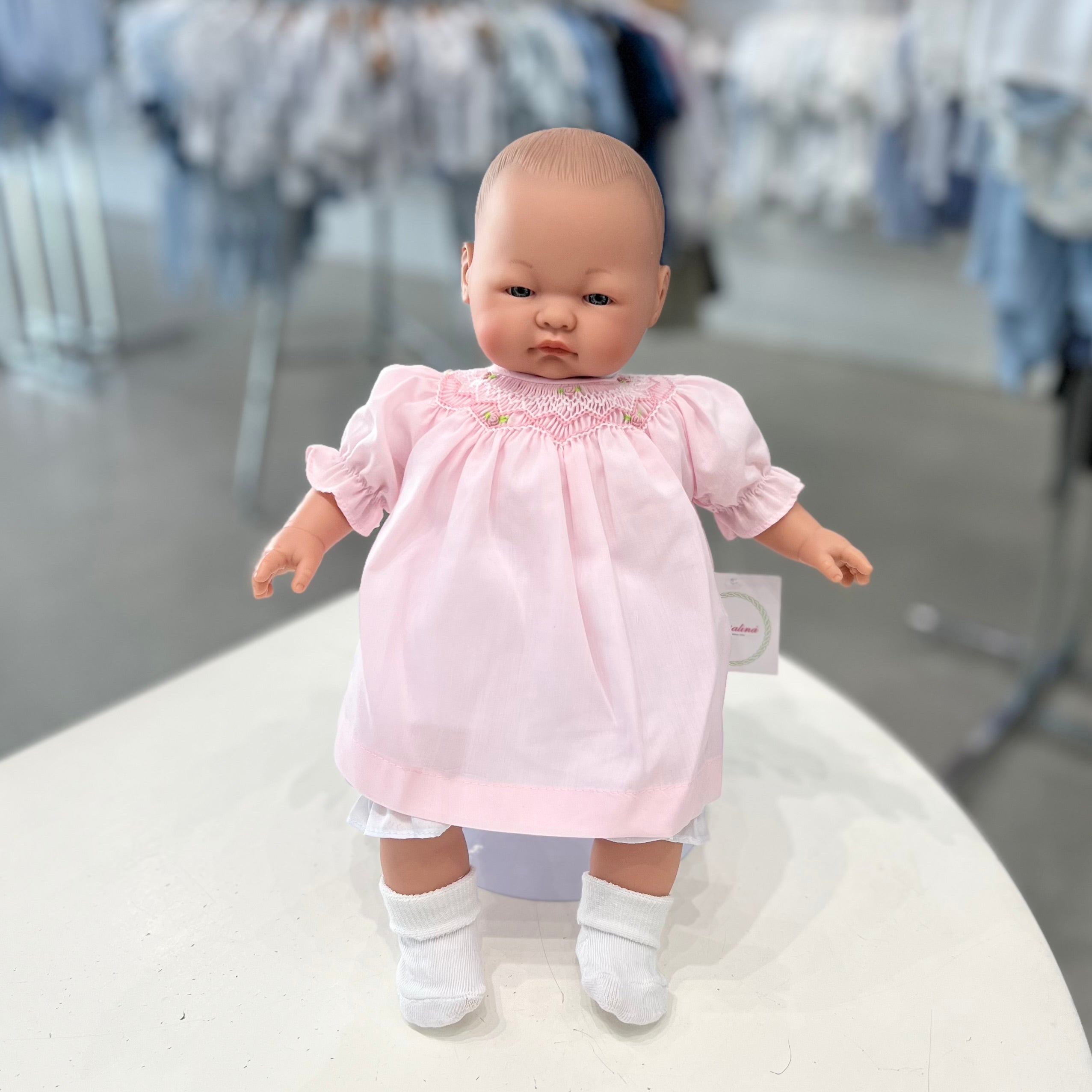 Rosalina Emma Bald Doll with Pink Roselle Bishop