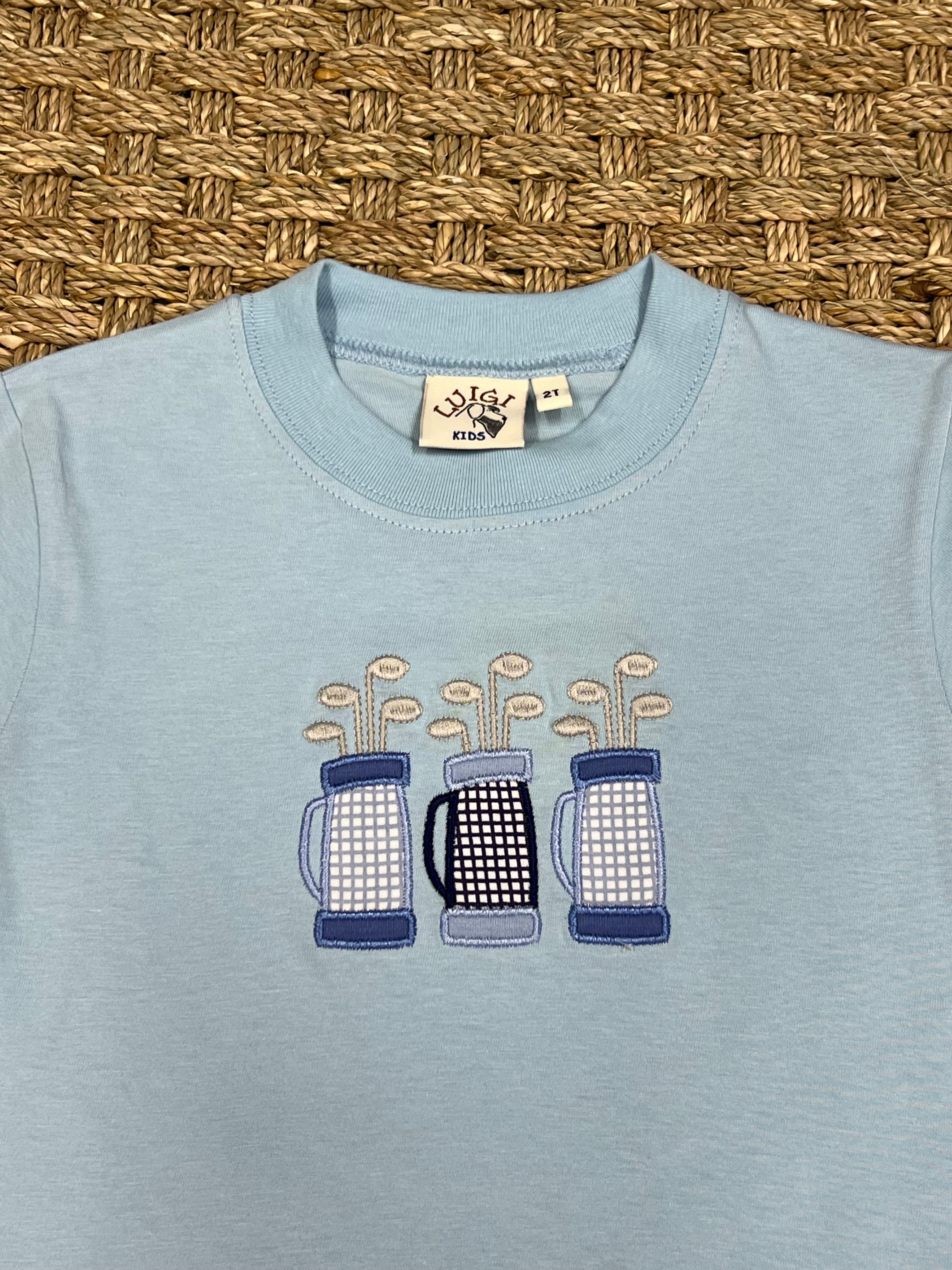 Luigi Tee, Three Golf Bags on Light Sky Blue