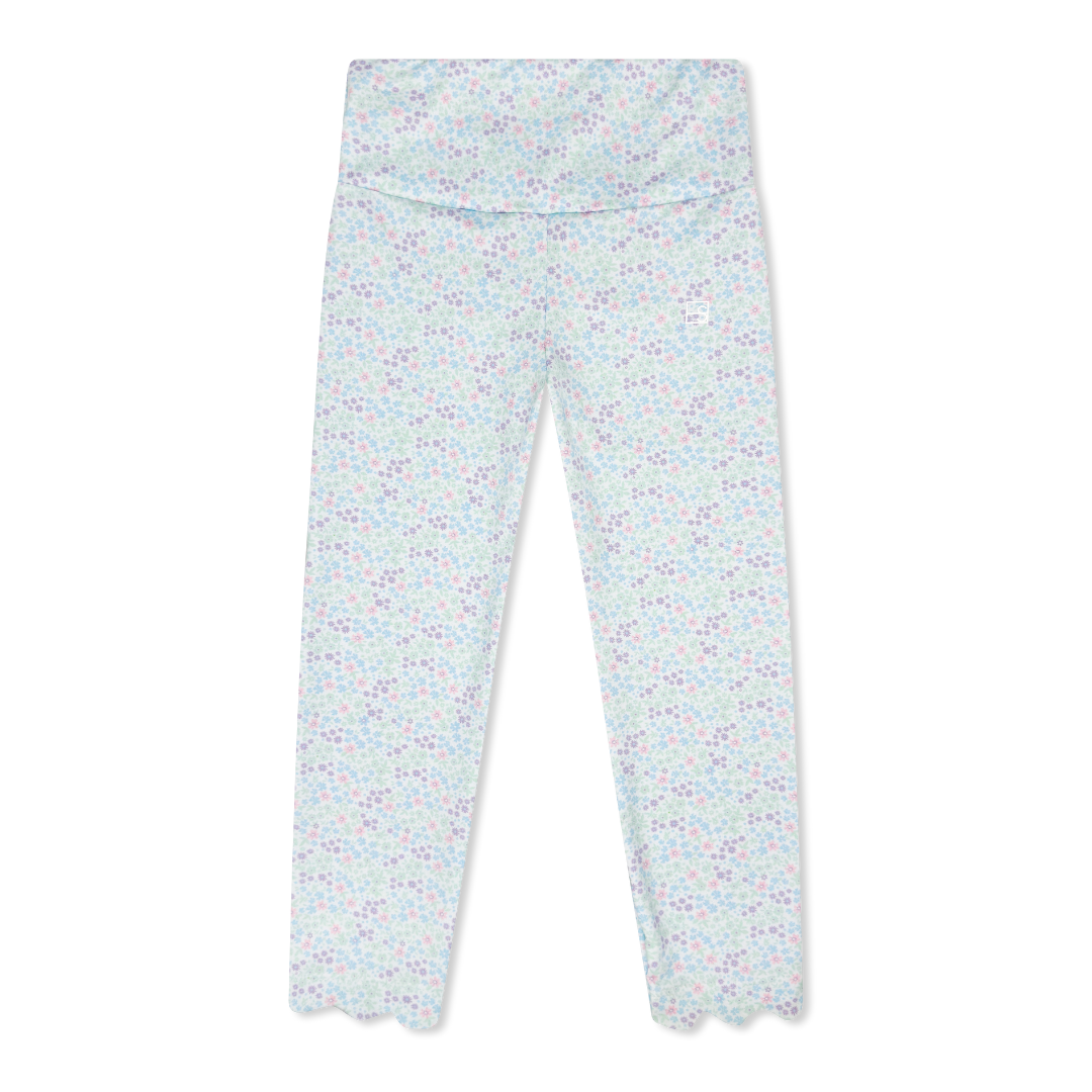 Light blue leggings with a subtle floral pattern on a white background