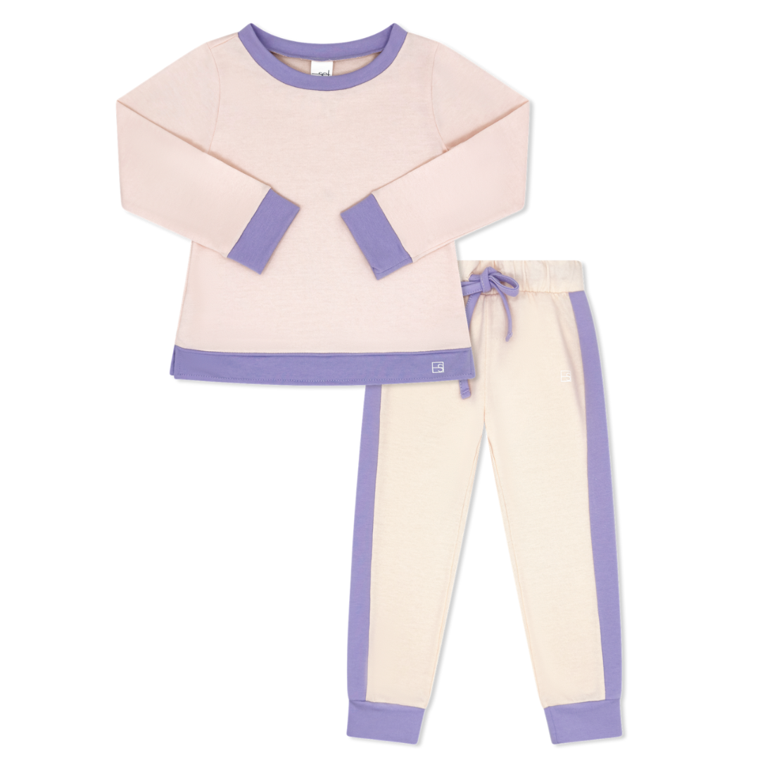 Children's jogger set with pink top and pants featuring purple accents on a white background