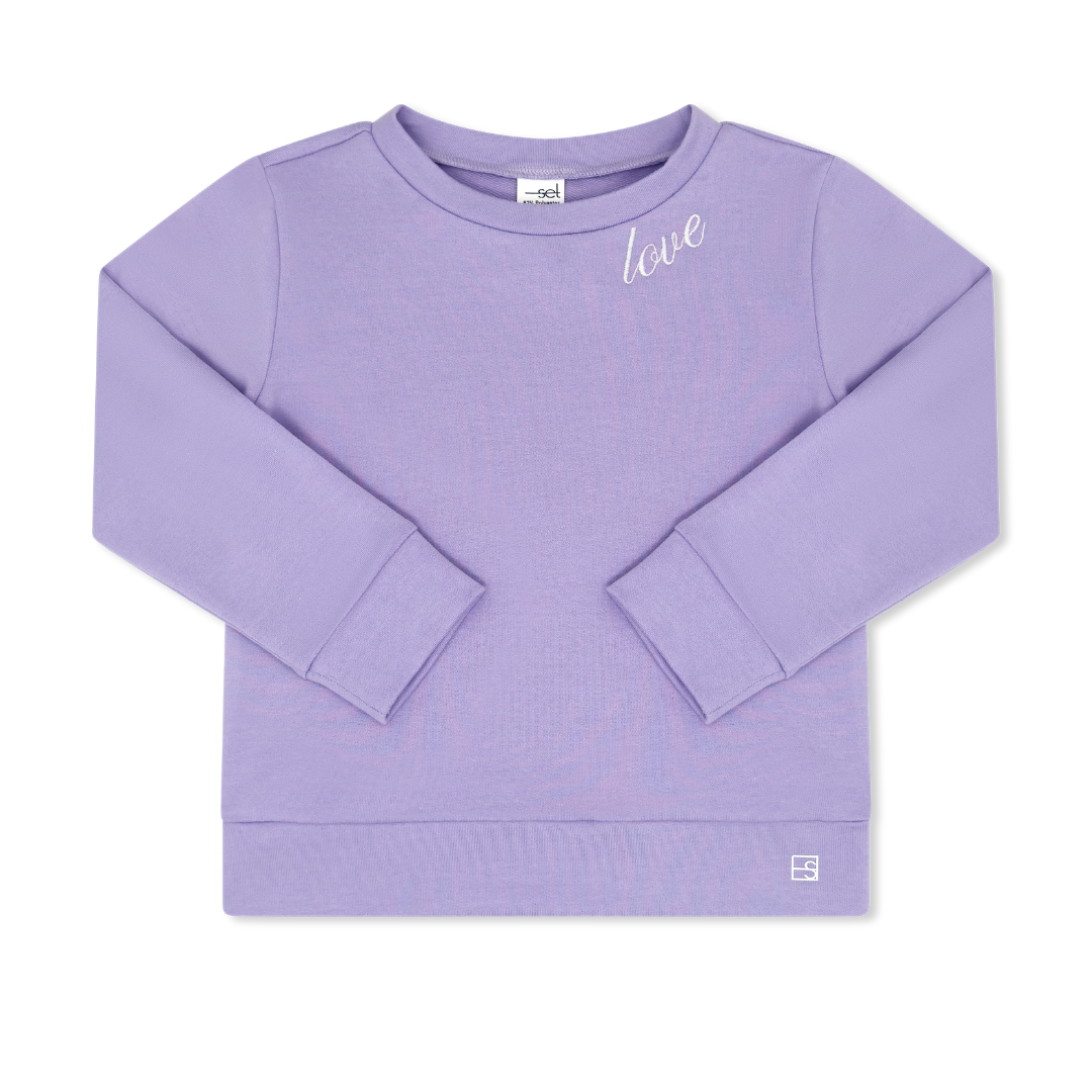 Purple sweatshirt with 'love' text on a white background