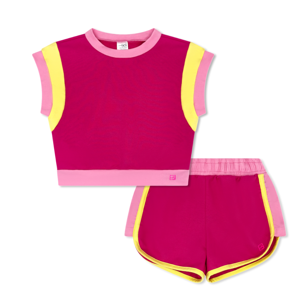 Pink and yellow children's sleeveless top and shorts set on a white background