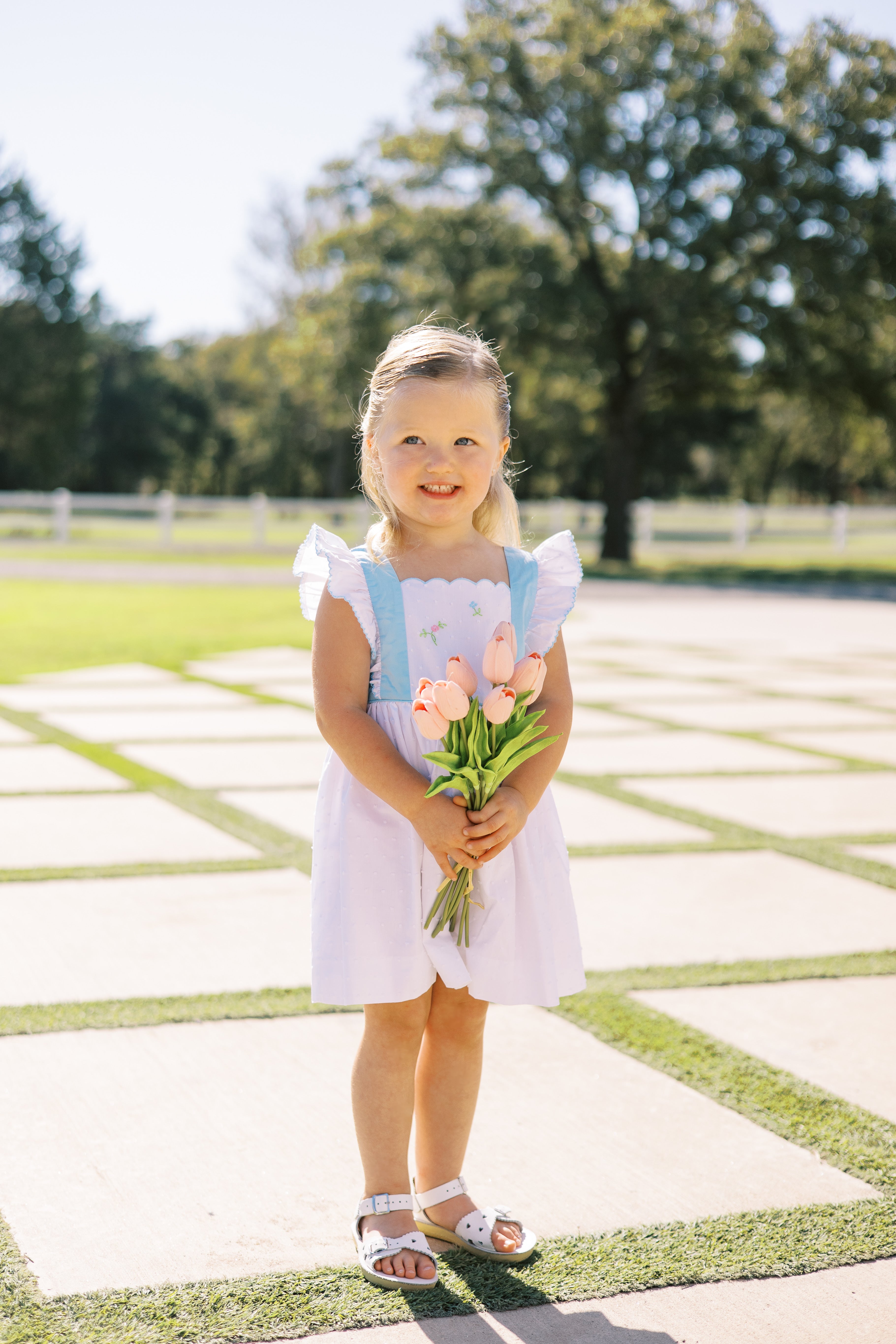 Proper Peony Posy White Swiss Pinafore | shopnurseryrhymes