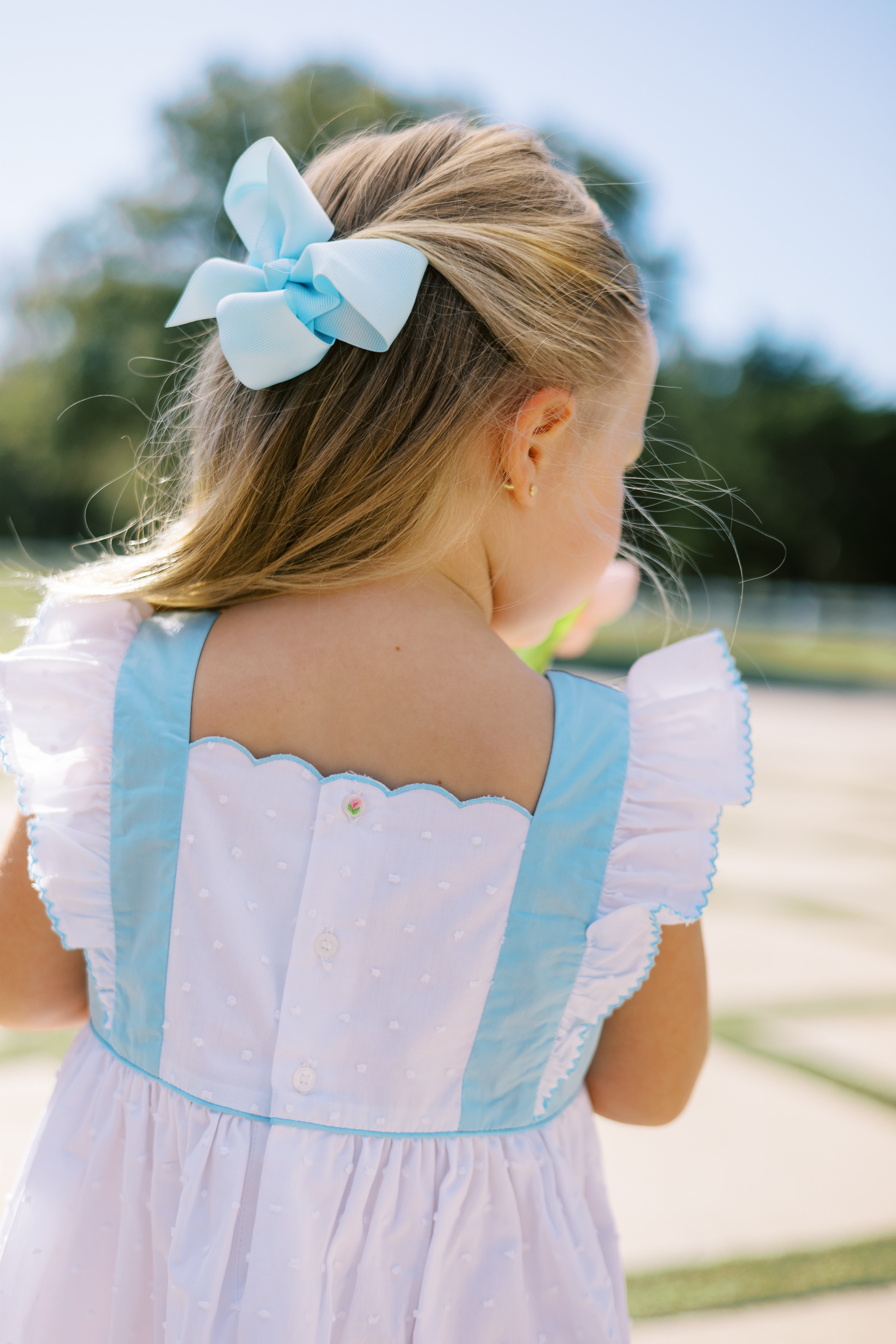 Proper Peony Posy White Swiss Pinafore | shopnurseryrhymes