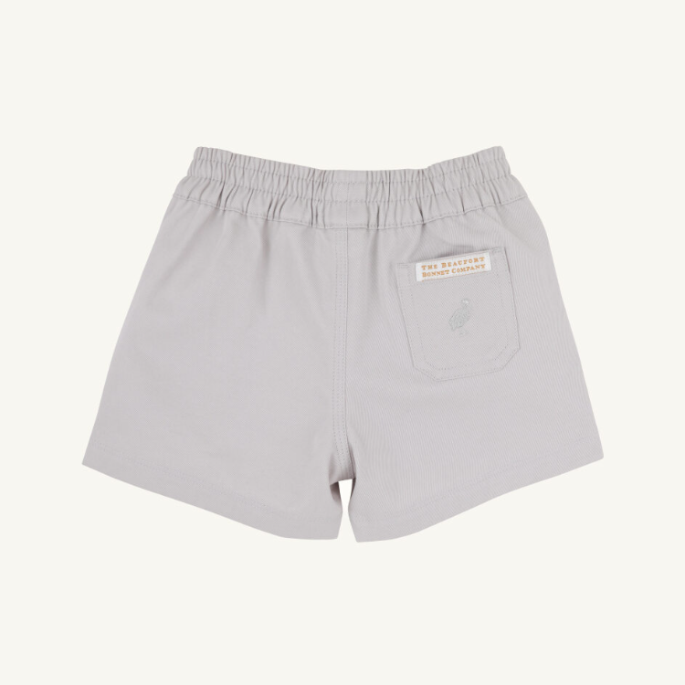 Light gray shorts with a brand label on a white background
